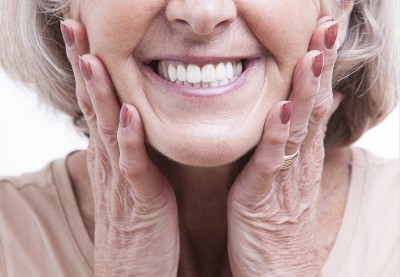 Older woman shows off her amazing dentures