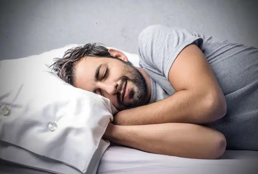 adult man happily asleep