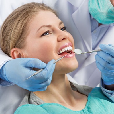 Woman being treated by dentist