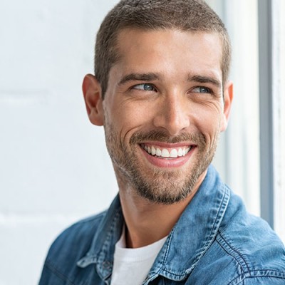 Man smiling and showing his teeth