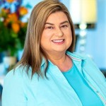 BethHFullFaceAfter-min (1) Woman with long hair smiling