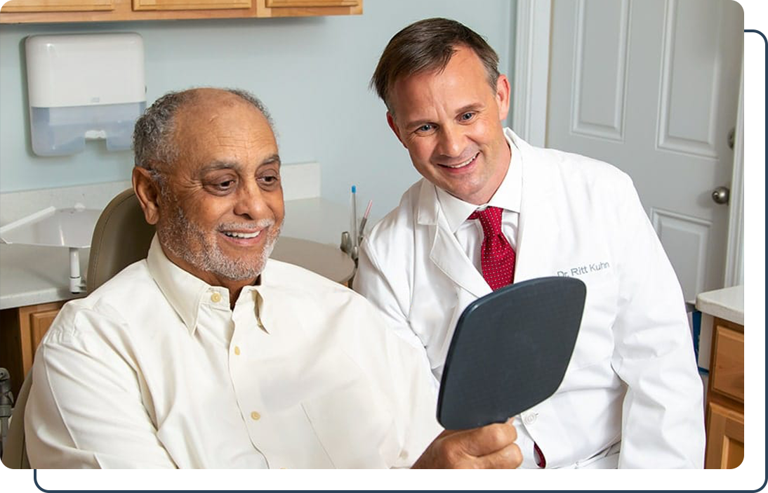 Dr. Ritt Kuhn presenting a new smile to a patient