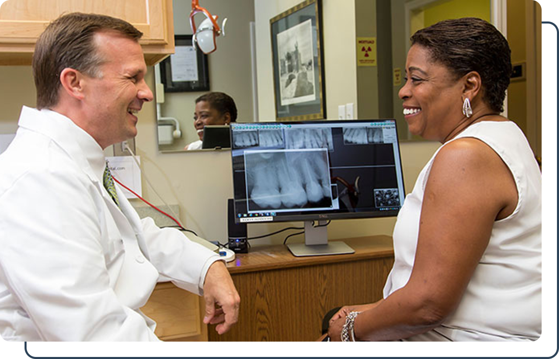 Dr. Kuhn discussing treatment with patient Dr. Ritt Kuhn talking about xrays with a patient